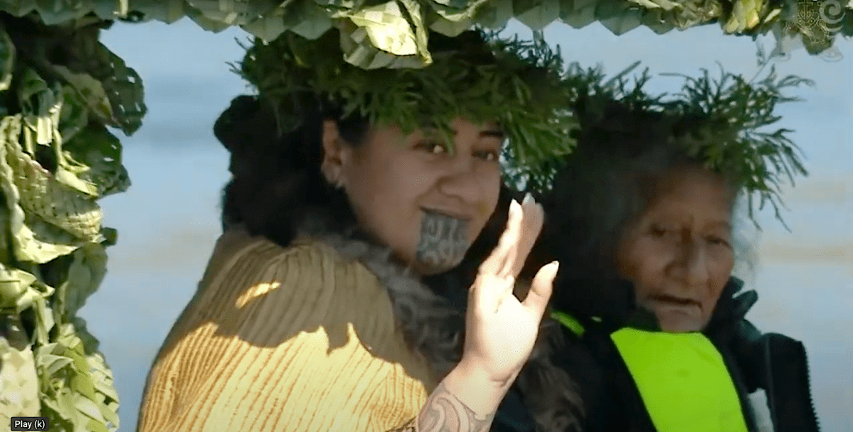 Kuini Nga wai hono i te po waves to mourners lining the Waikato River, from the waka on which she accompanied her father's casket to Taupiri maunga. Photo: RNZ